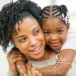 Mother and daughter hugging with the spa central coast logo