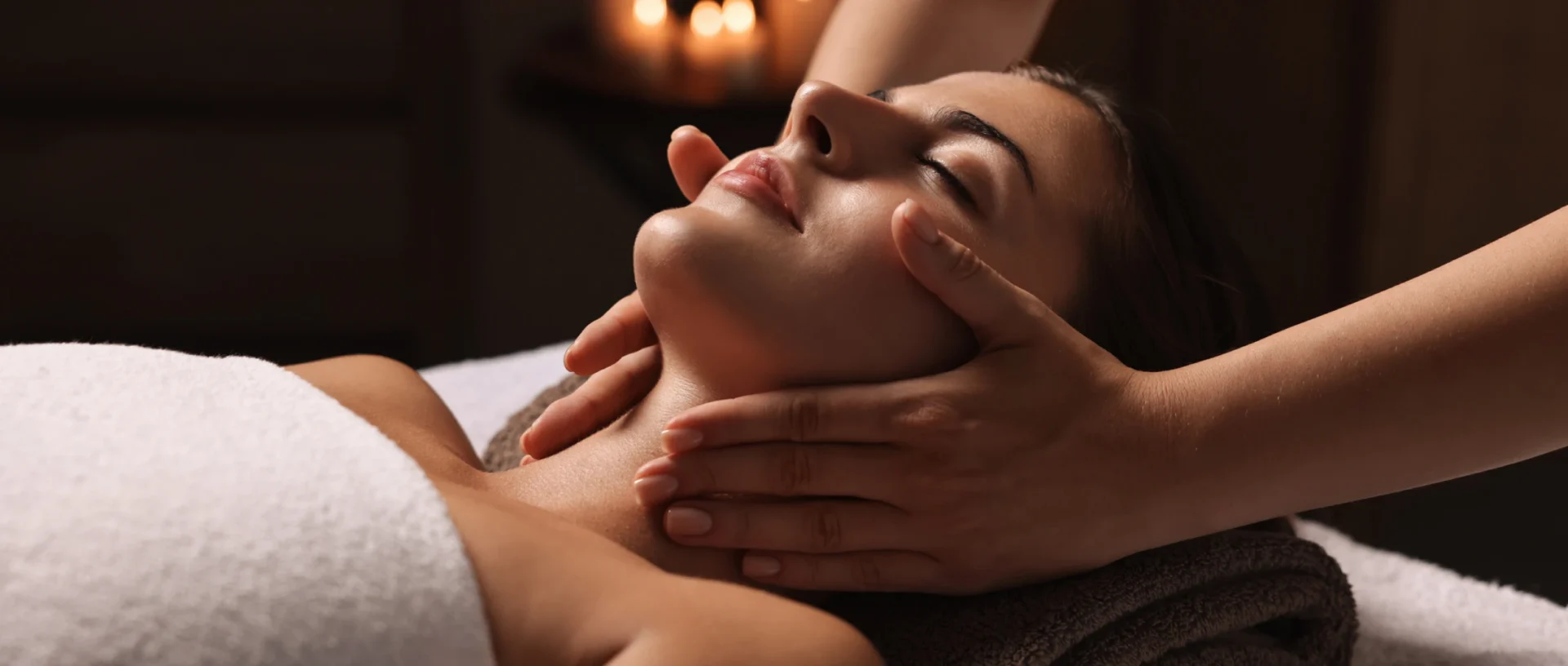 Woman receiving a relaxing facial massage